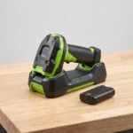 Zebra DS3678 cordless barcode scanner in charging cradle with spare battery pack